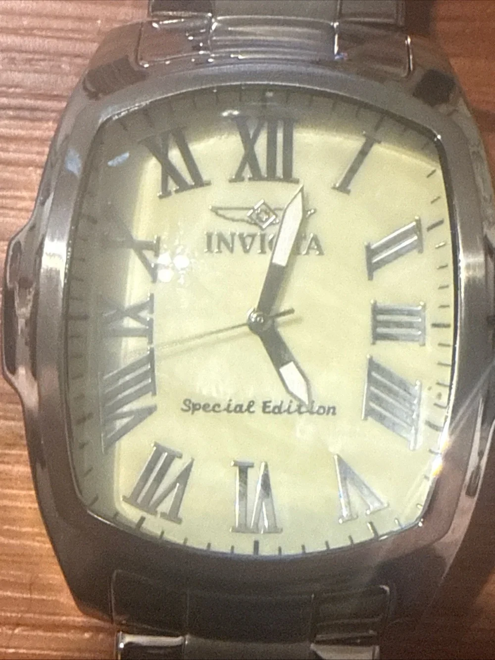 Watch on wooden surface